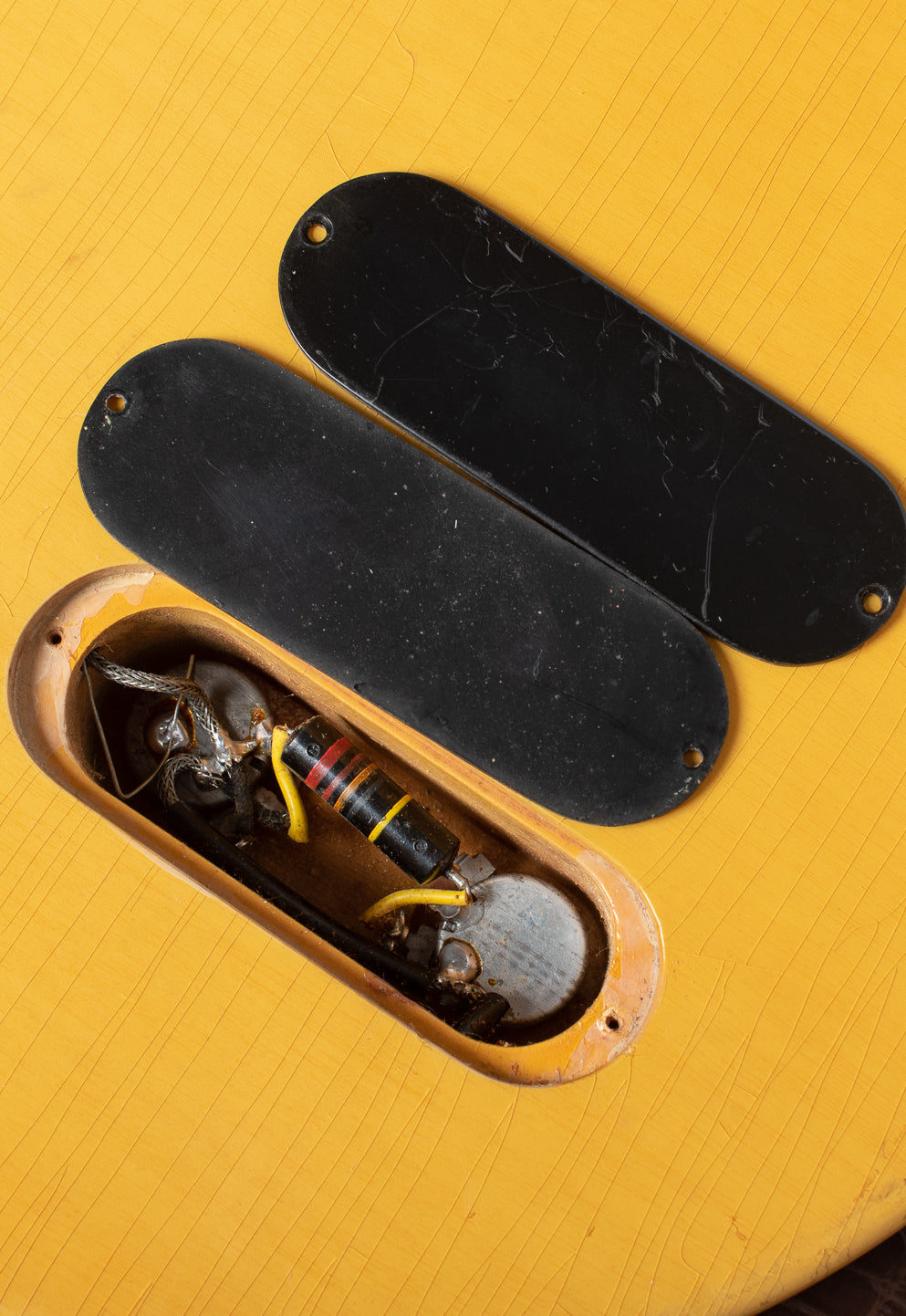 Double depth relief depth cut with double stacked control plates, bright yellow spaghetti capacitor lead covers. Gibson Les Paul TV Junior 1958