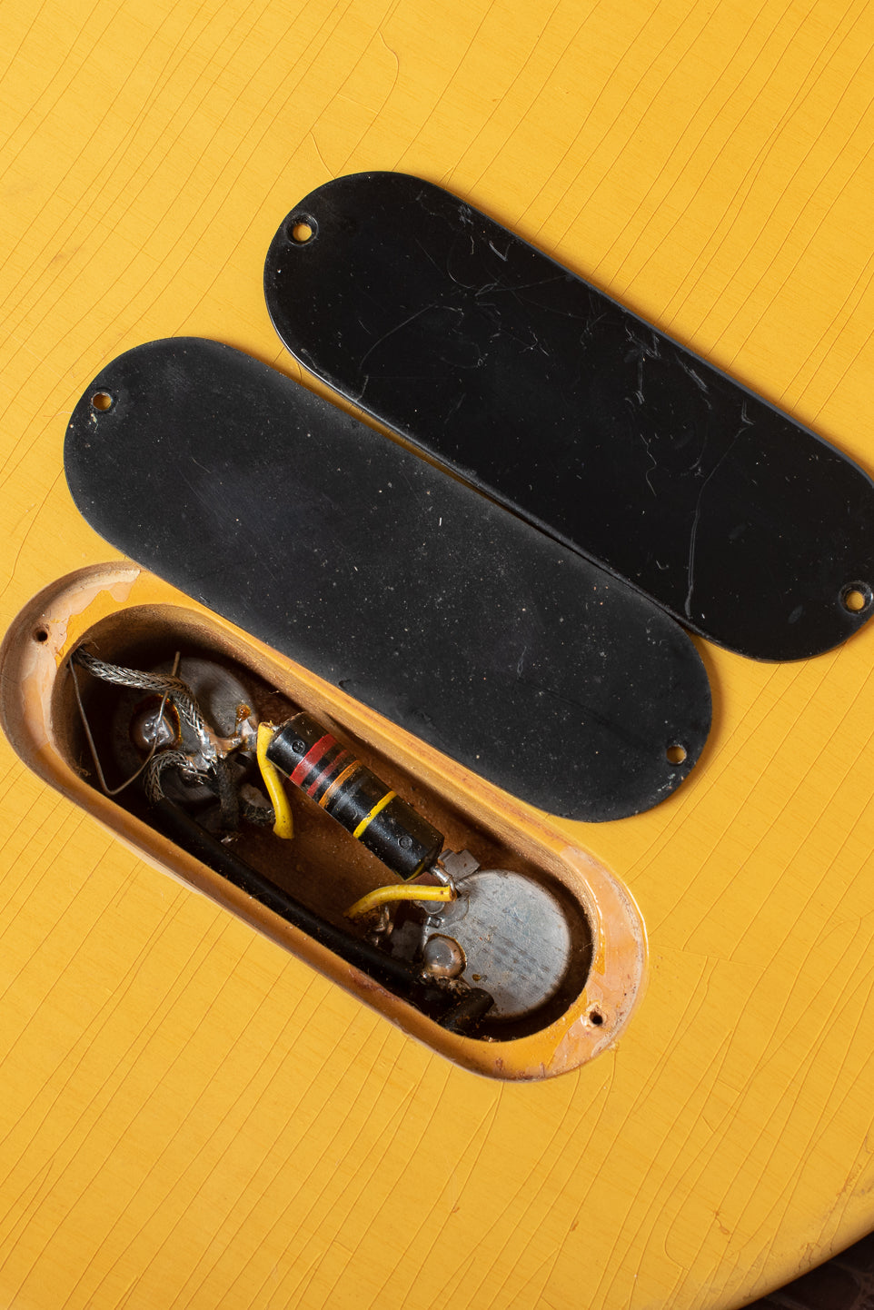 Double depth relief depth cut with double stacked control plates, bright yellow spaghetti capacitor lead covers. Gibson Les Paul TV Junior 1958