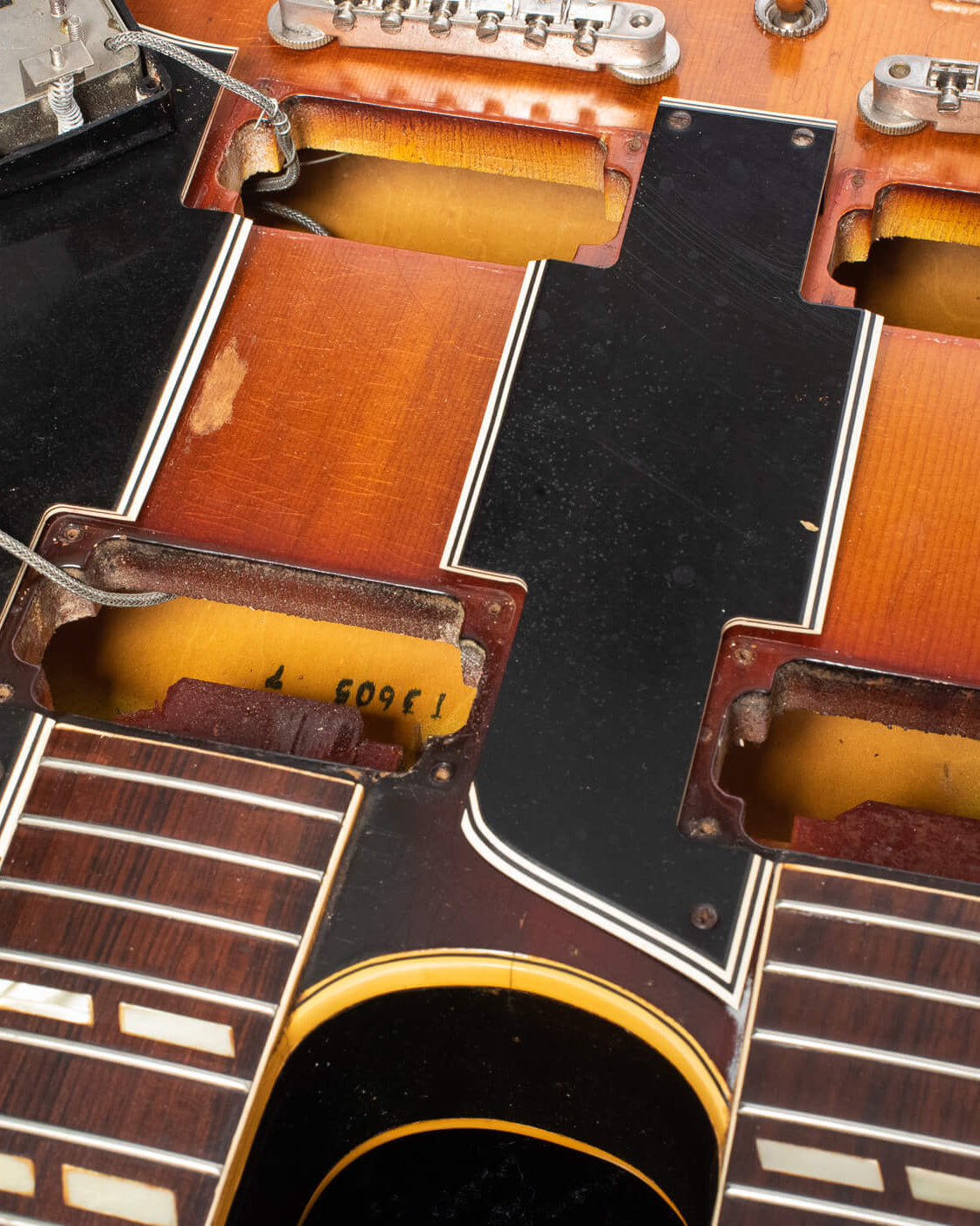 Factory Order Number letter prefix T inside the neck pickup cavity