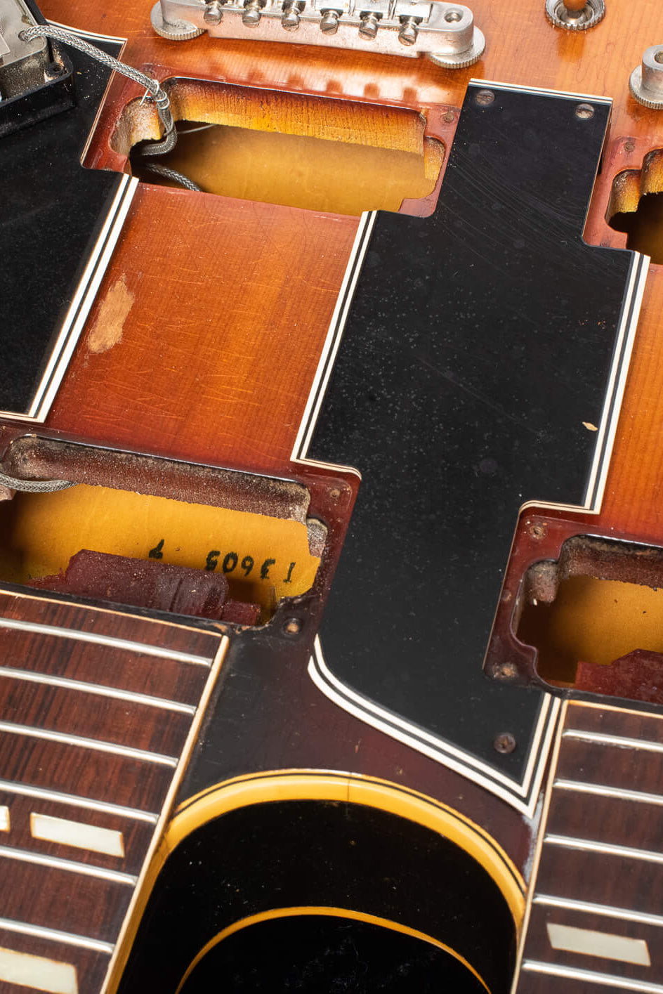 Factory Order Number letter prefix T inside the neck pickup cavity