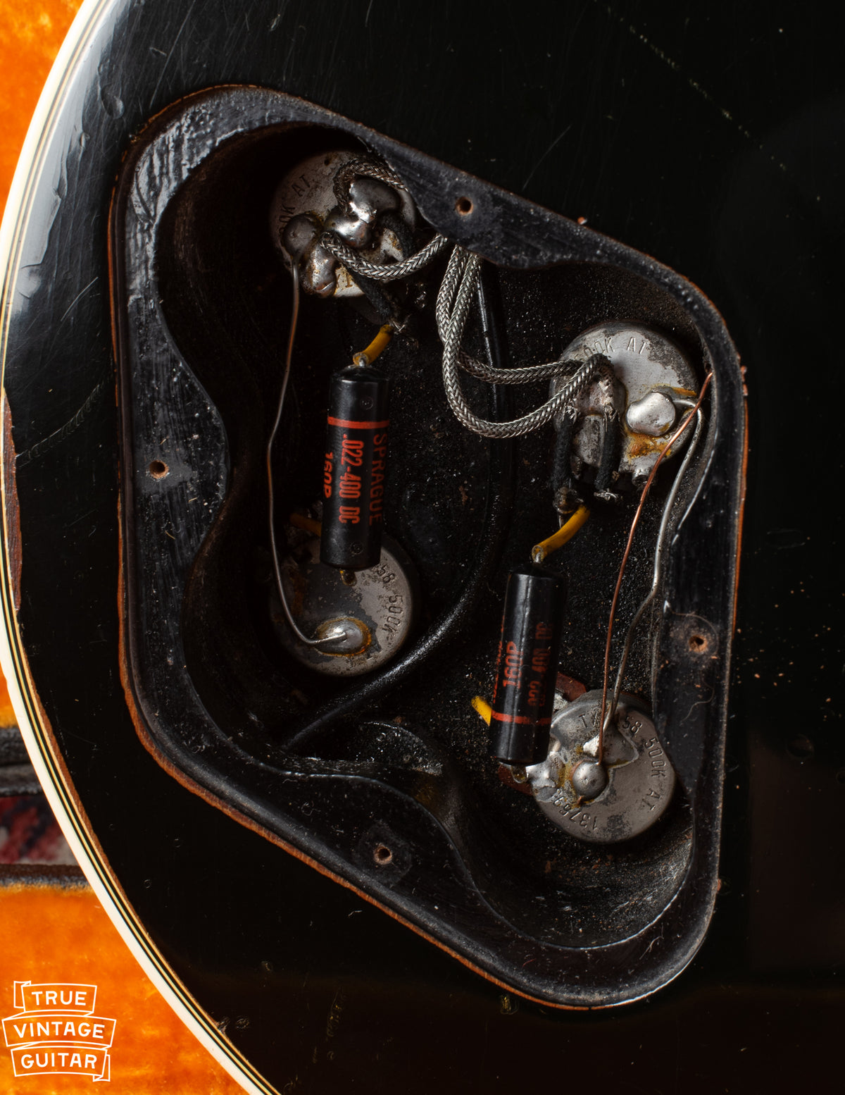 Control cavity with black Sprague capacitors, 1969 potentiometer codes