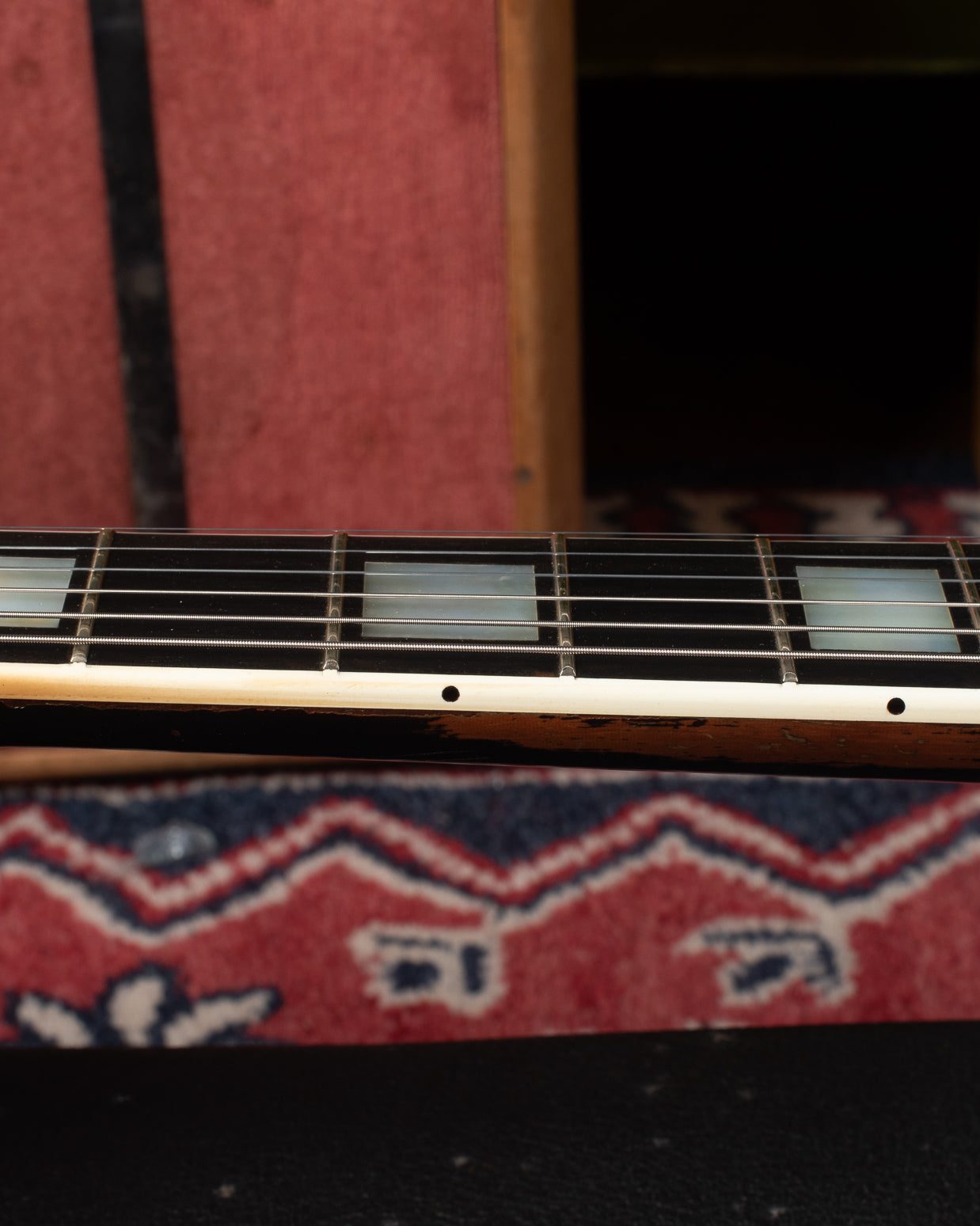 Refret inside the binding preserving the nibs on 1969 Gibson Les Paul Custom.