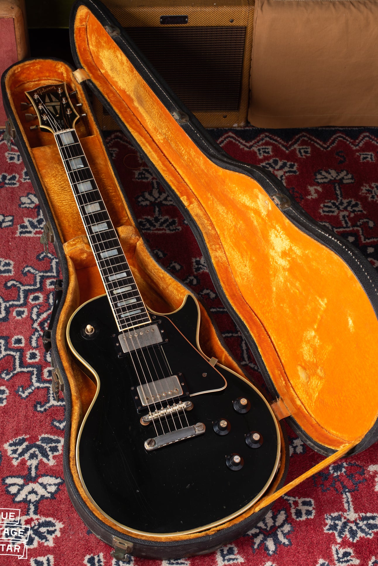 1969 Gibson Les Paul Custom black with gold hardware in yellow and black case.
