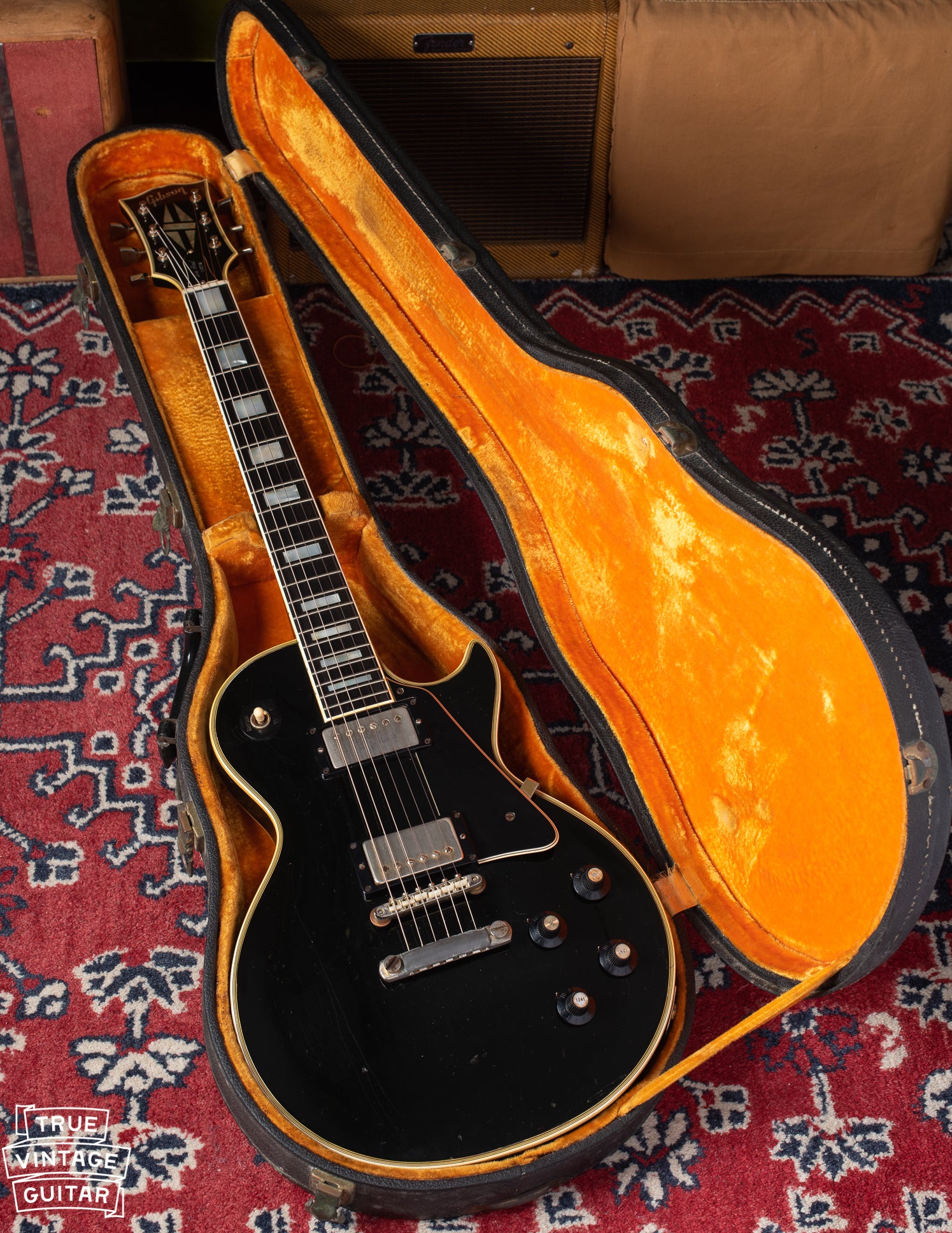 1969 Gibson Les Paul Custom black with gold hardware in yellow and black case.