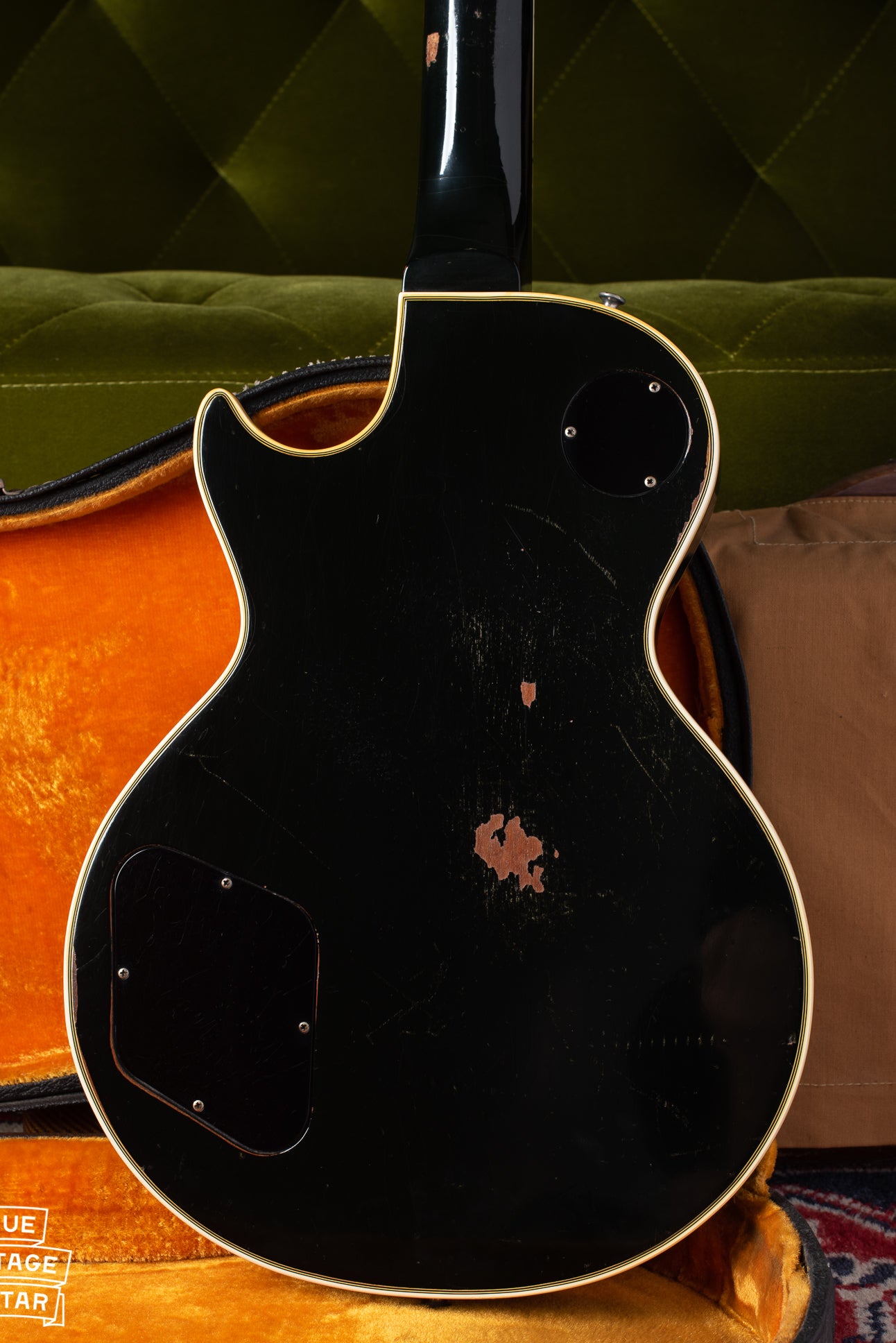 Back of body of 1969 Gibson Les Paul Custom black guitar with gold parts..