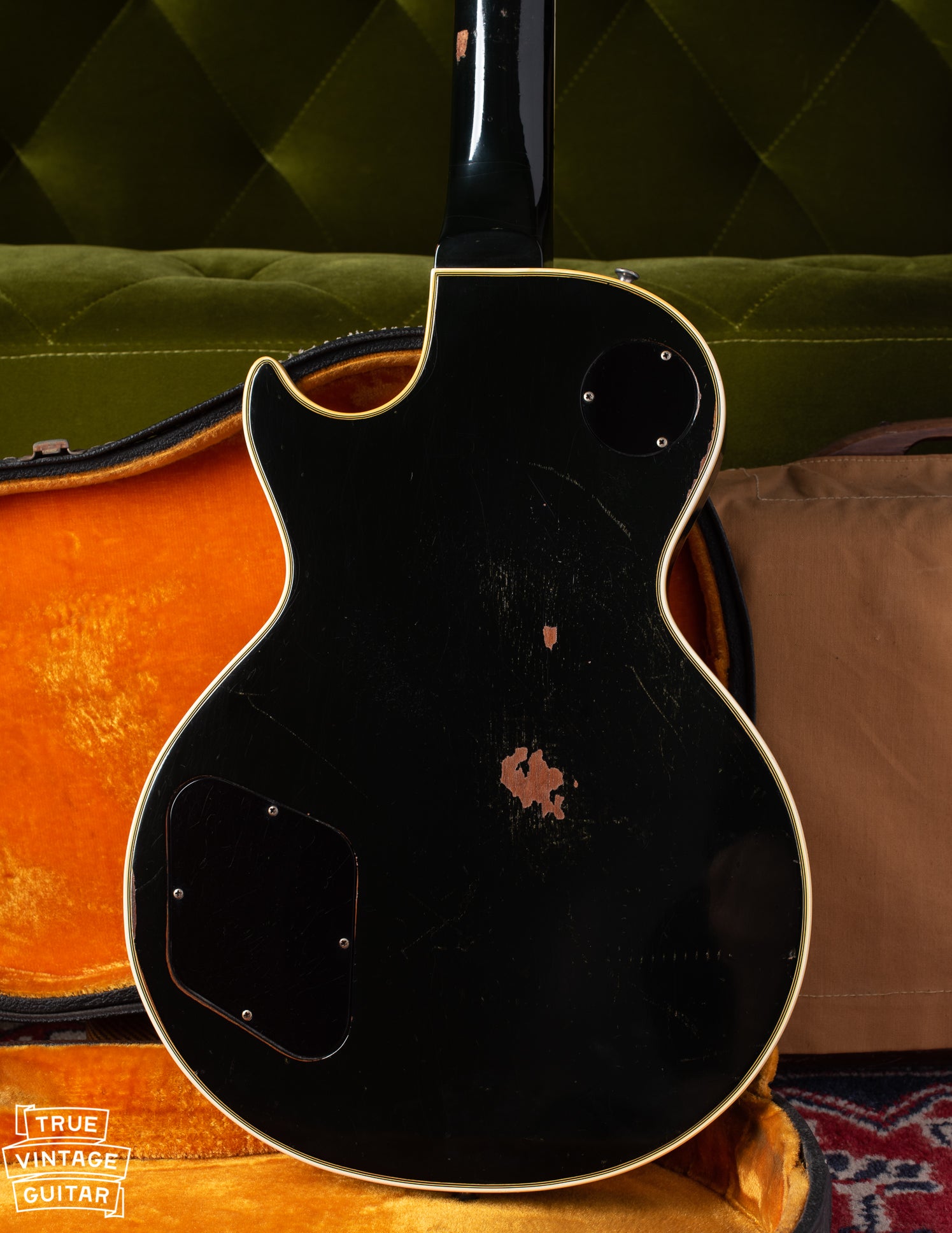 Back of body of 1969 Gibson Les Paul Custom black guitar with gold parts..