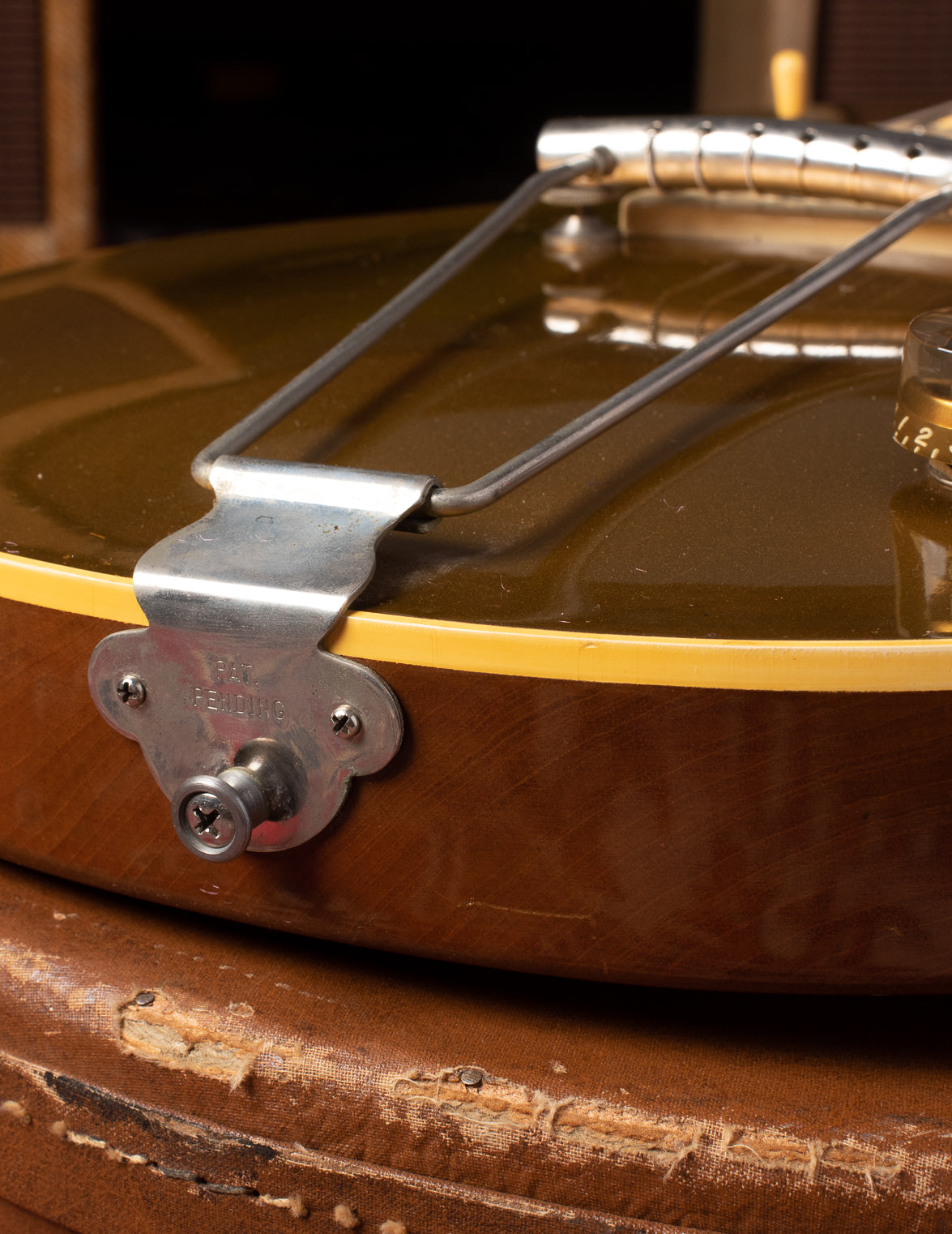PAT PENDING stamp on trapeze tailpiece