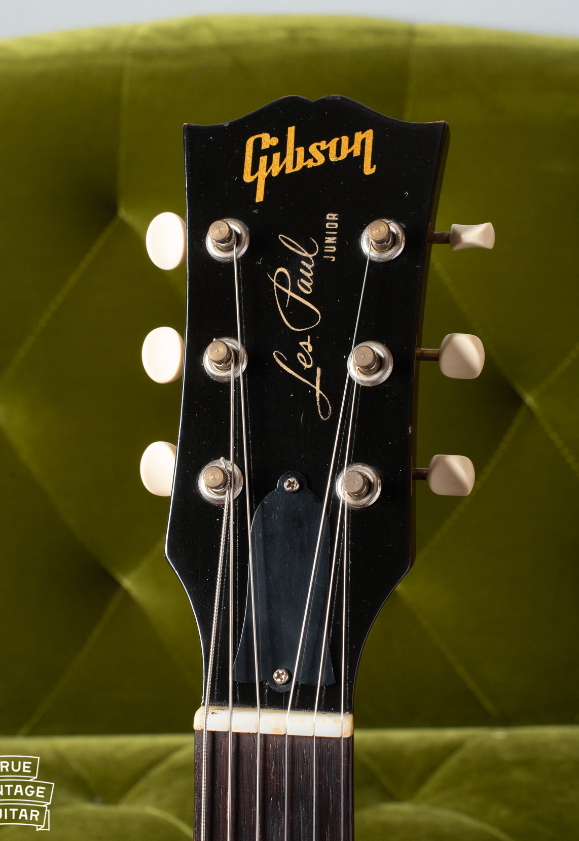 Black Headstock showing gold Gibson logo and Les Paul signature with Junior model underneath