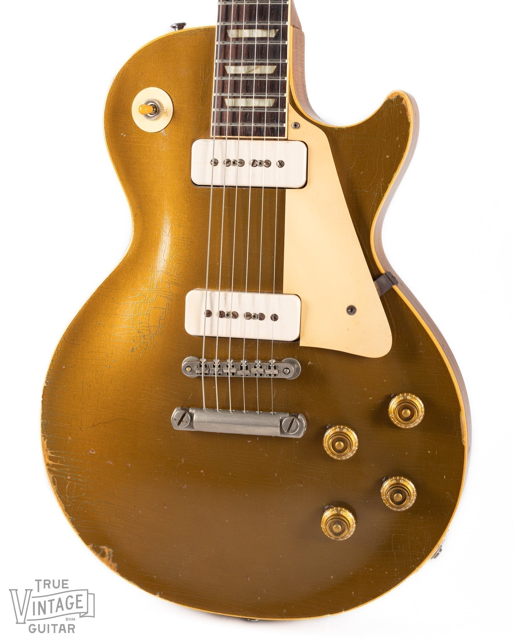 This image shows the body of a 1956 Gibson Les Paul Standard goldtop guitar. This page contains information about the history and value of these guitars.