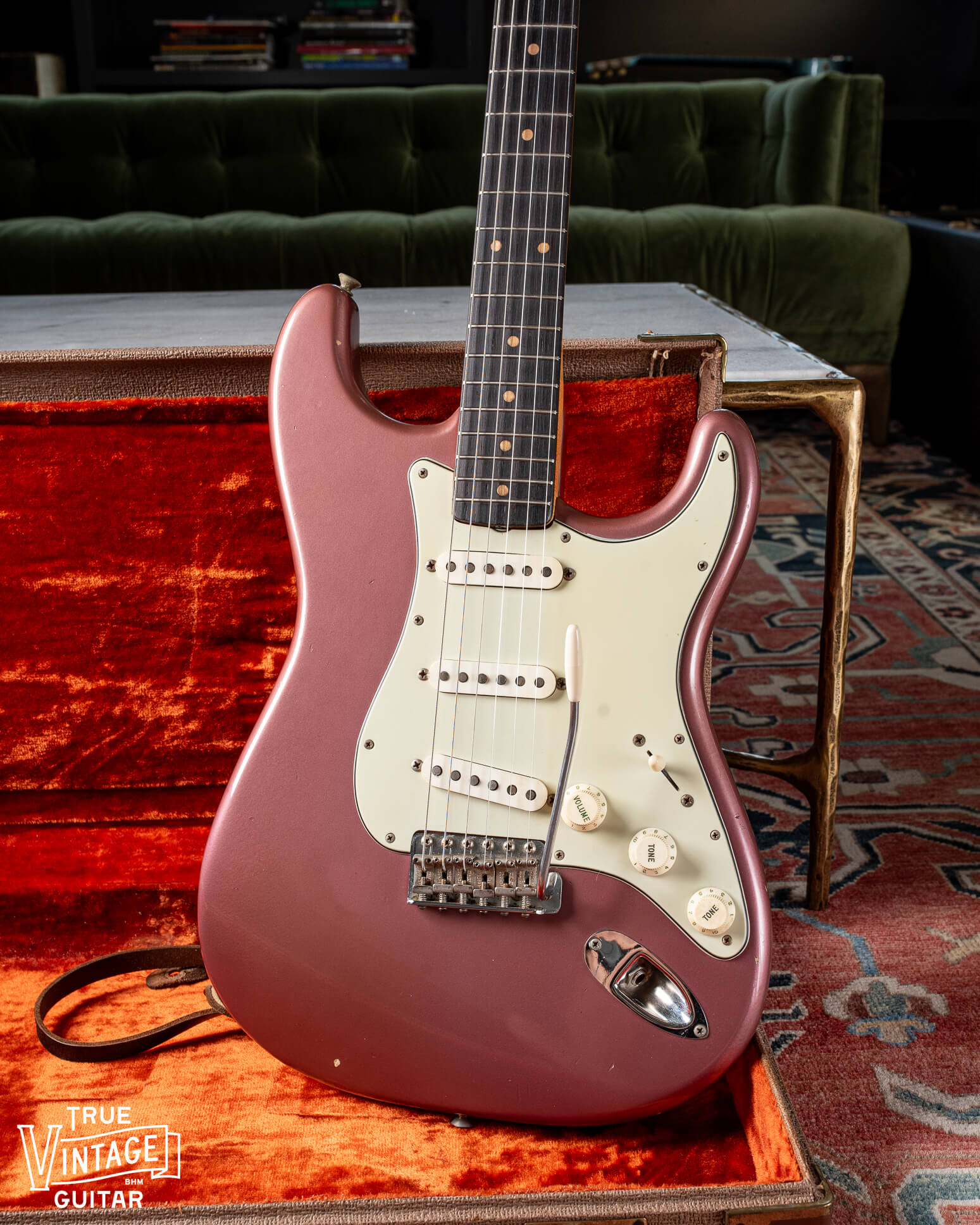 1963 Fender Stratocaster with Burgundy Mist finish, mint green pickguard, clay dots, and veneer Rosewood fretboard
