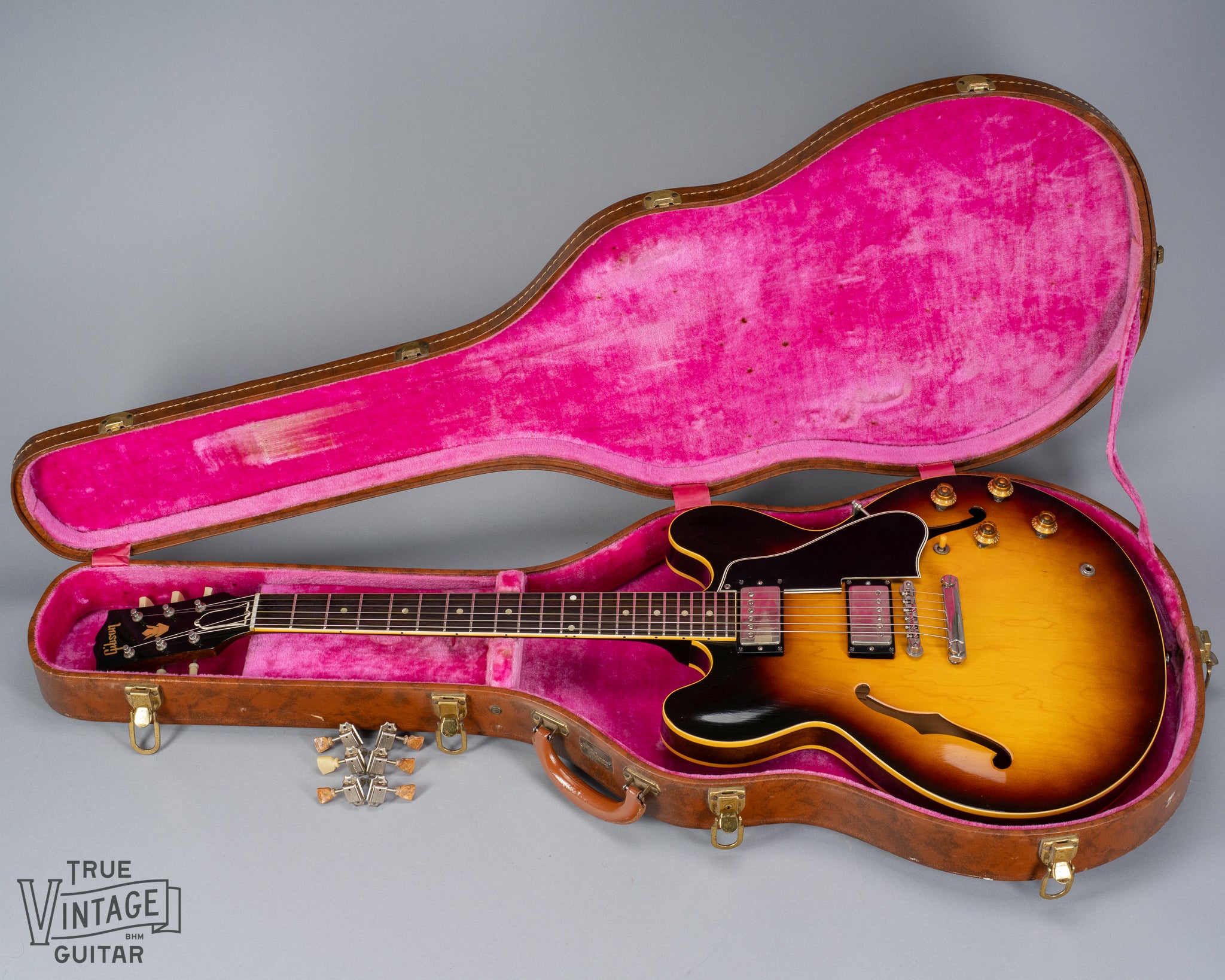 Landscape photo of 1959 Gibson ES-335 in original pink lined Lifton hardshell case