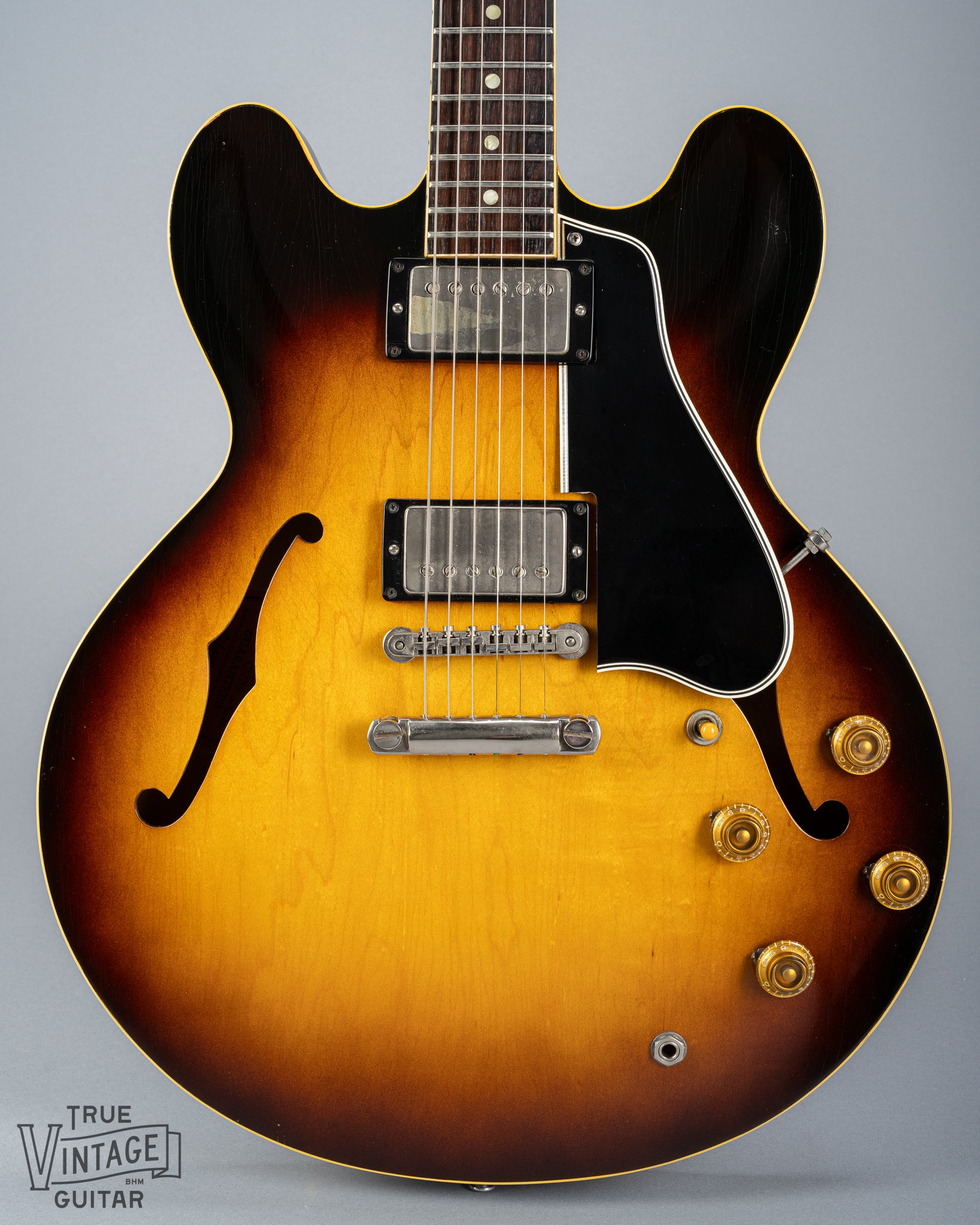 This image shows the front of the body of a 1959 Gibson ES-335 vintage guitar in original Sunburst finish with stop bar tailpiece. 