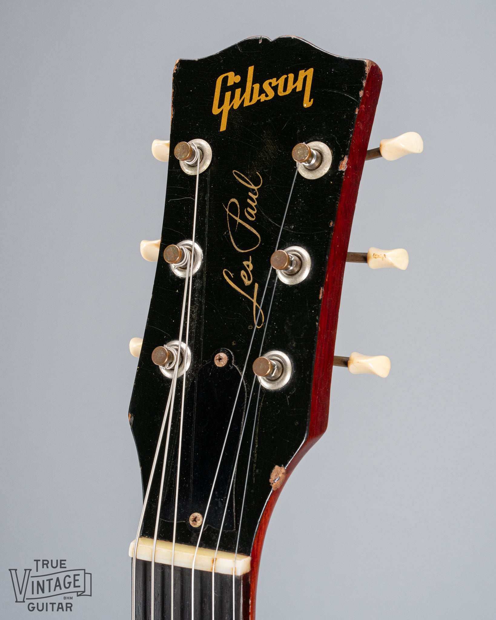 front of 1959 Gibson Les Paul Junior cherry guitar tuning machines tuner buttons logo print nut truss rod cover 