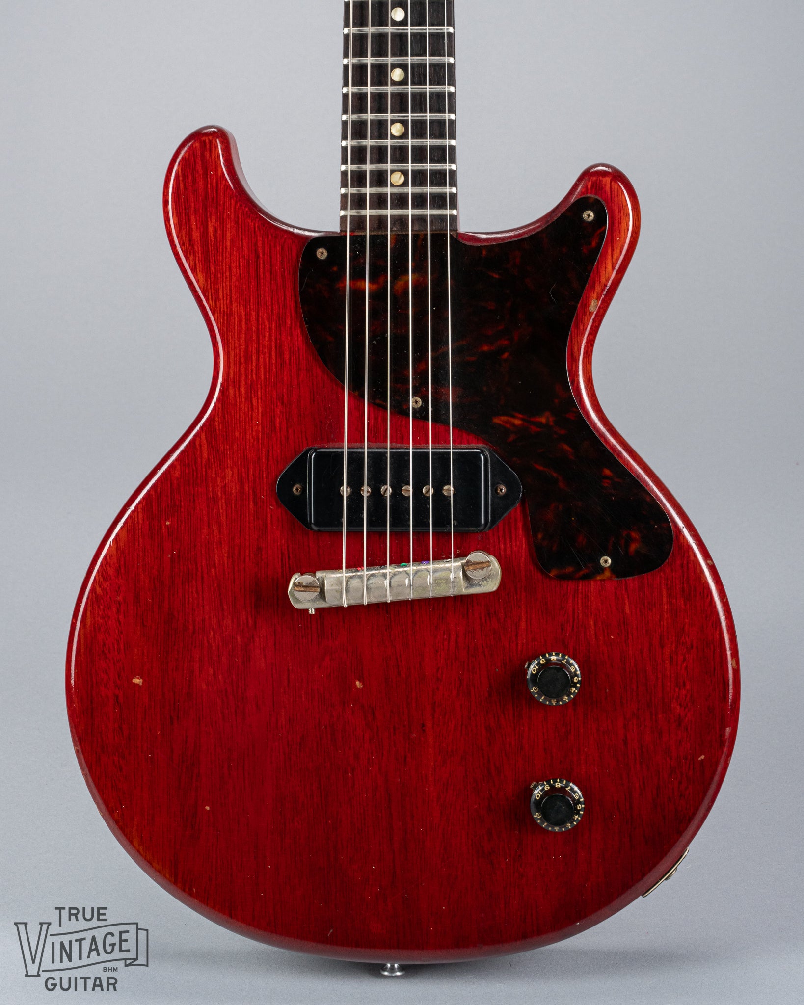 Front of 1959 Gibson Les Paul Junior cherry guitar dog ear p90 pickup tortoise pickguard volume and tone controls wrap around tail piece bridge fretboard original frets inlays 