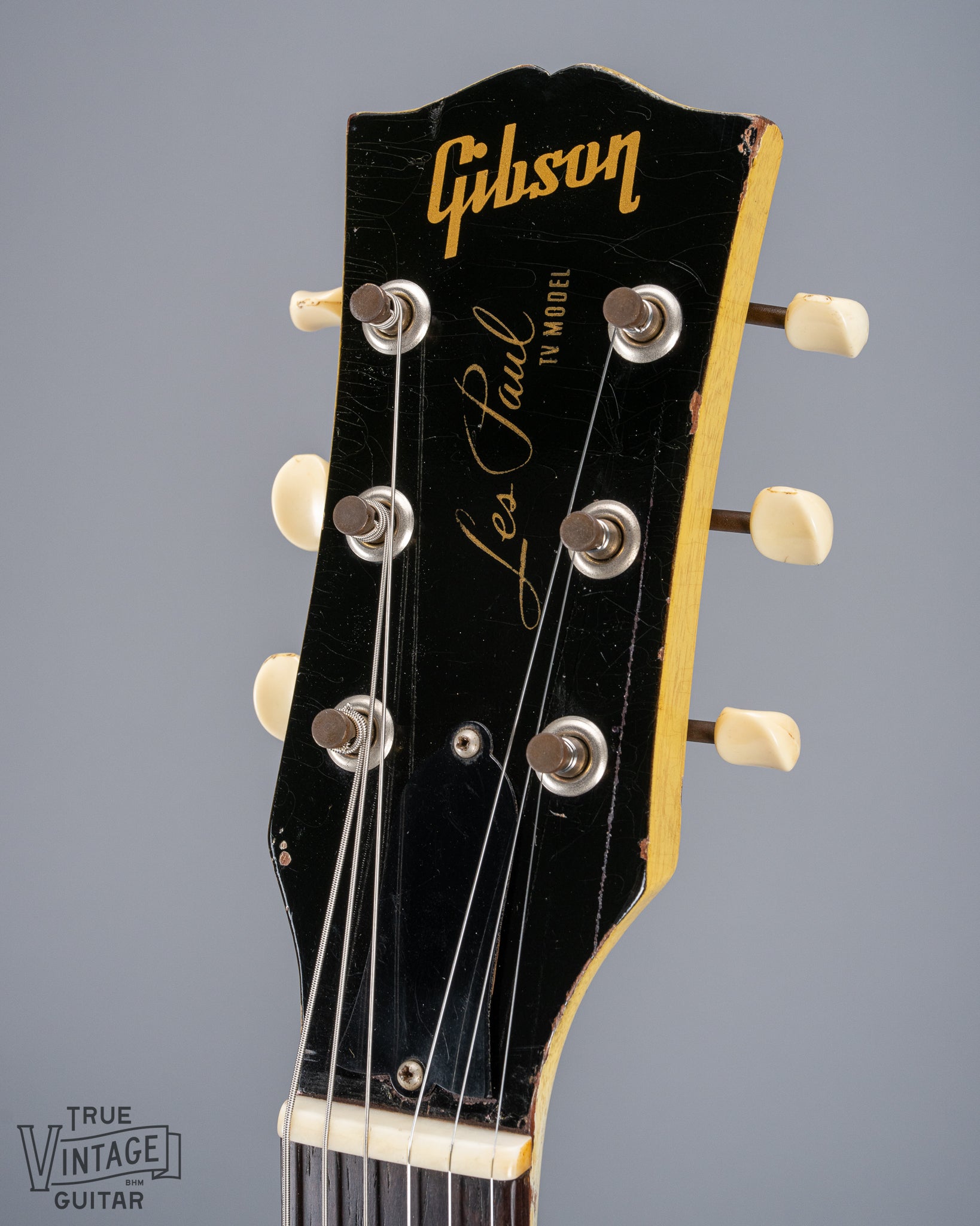 Front of 1959 Gibson Les Paul TV Model headstock, Logo, TV yellow, tuning machines, tuner buttons