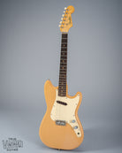 Front of 1960 Fender Musicmaster desert sand guitar body neck headstock fretboard volume tone controls single coil pickups