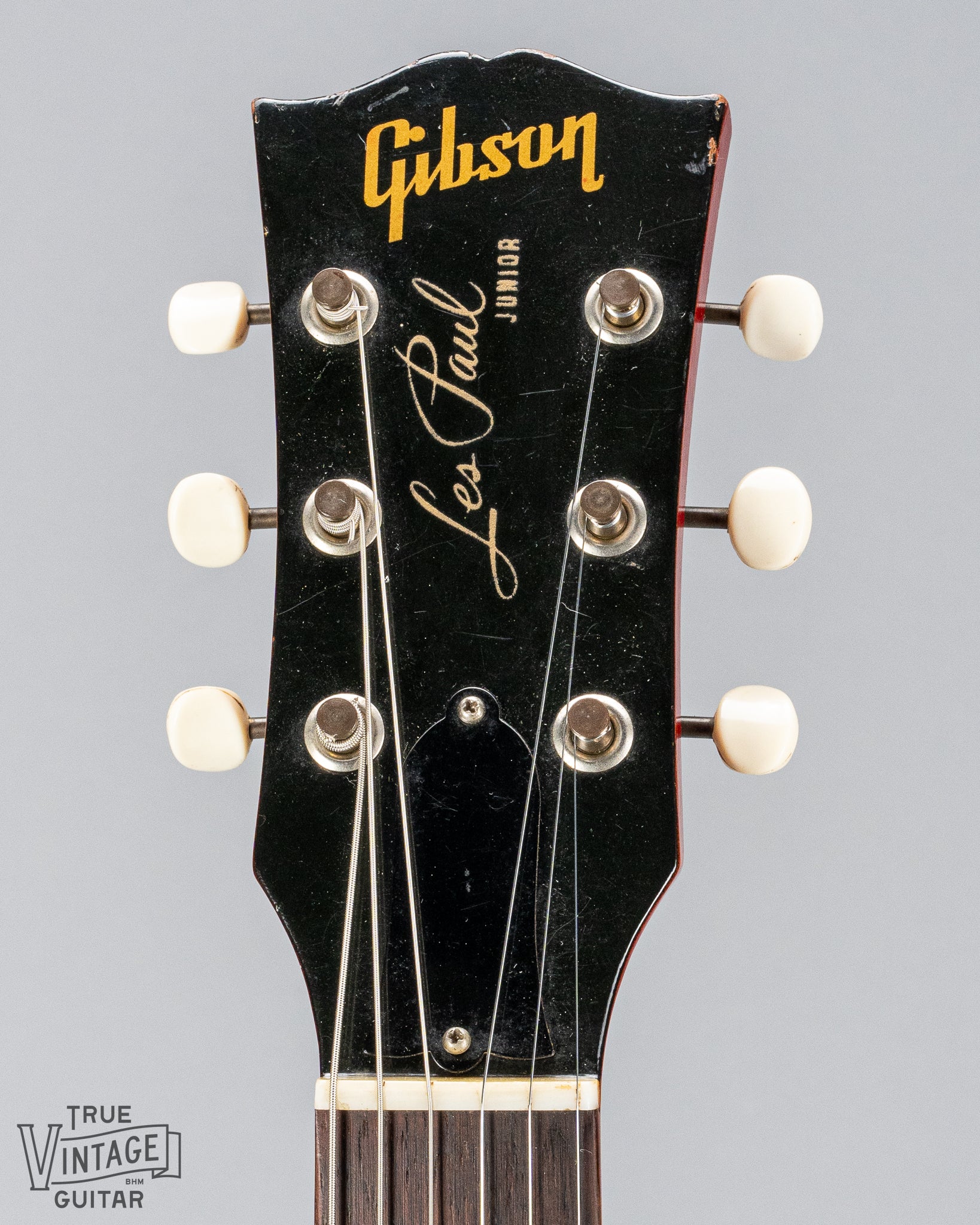 Front of Gibson Les Paul Junior Cherry red guitar headstock tuners nut and Gibson Les Paul Junior logo 