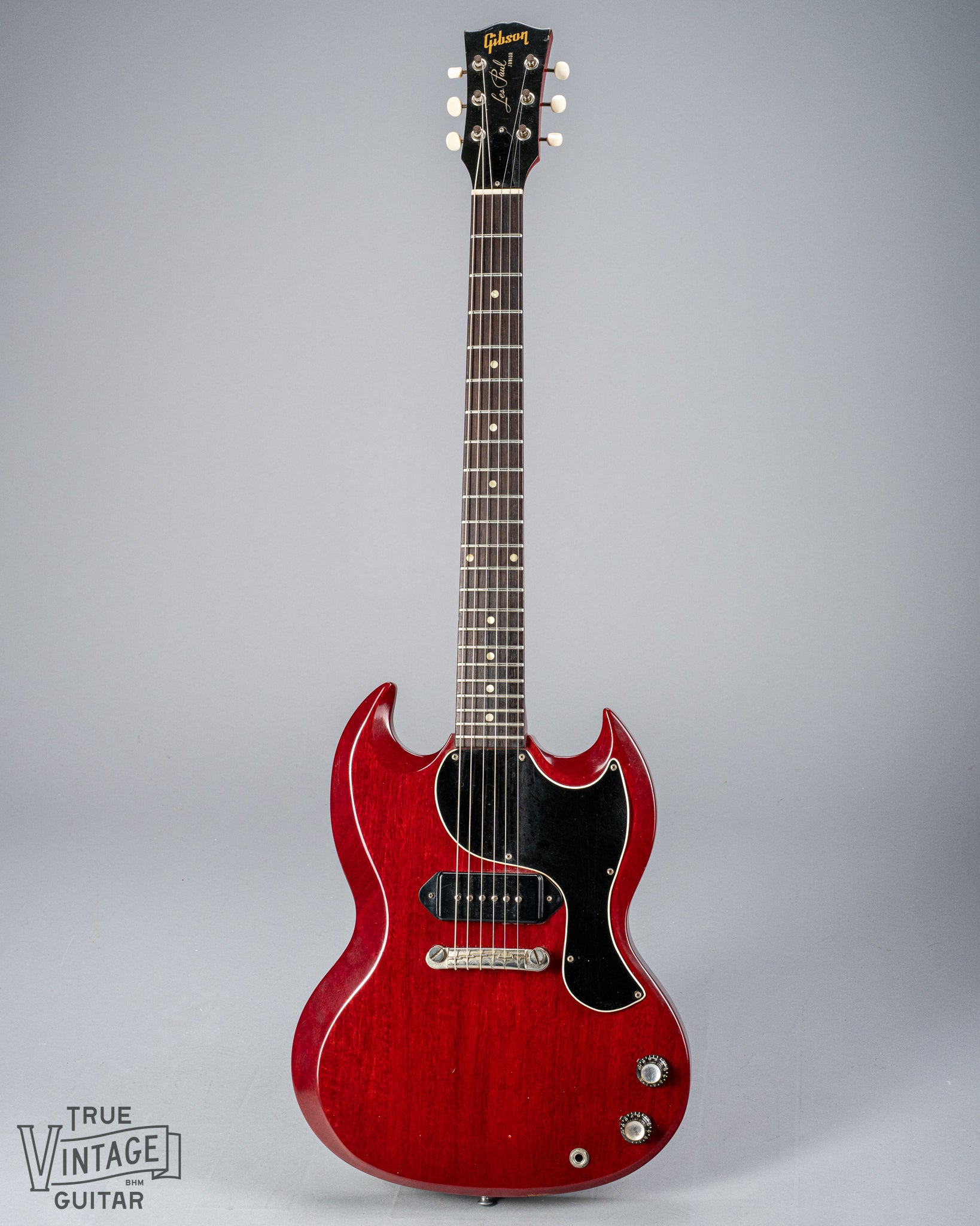 Front of Gibson Les Paul Junior Cherry red guitar P90 pickup neck headstock fretboard