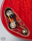 Front of Gibson Les Paul Junior Cherry red guitar control cavity electronics pots wiring output jack