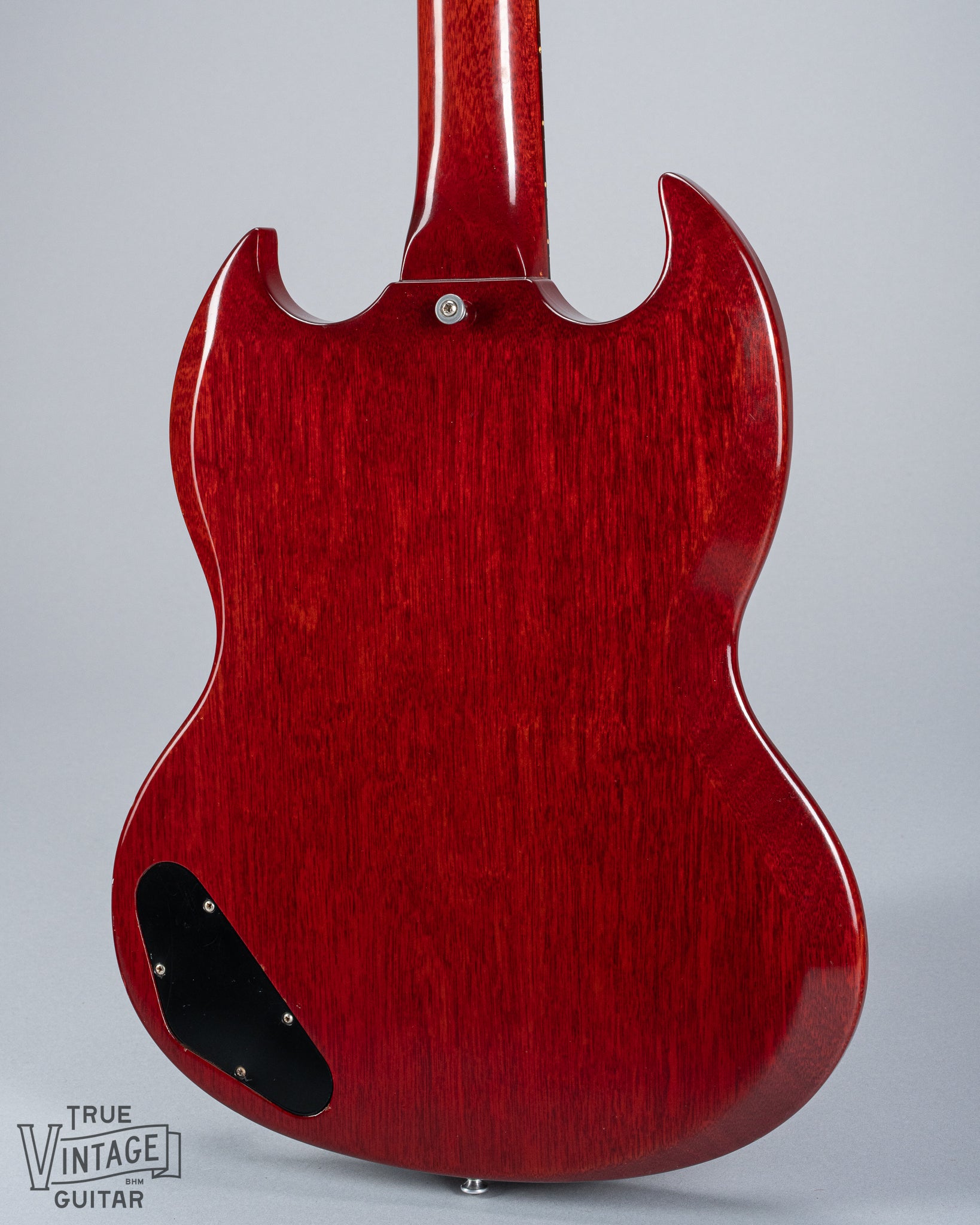 back of 1964 Gibson SG Junior Cherry guitar body pickguard dog ear P90 bridge wrap around tailpiece volume and tone controls fretboard original frets control cavity plate strap button