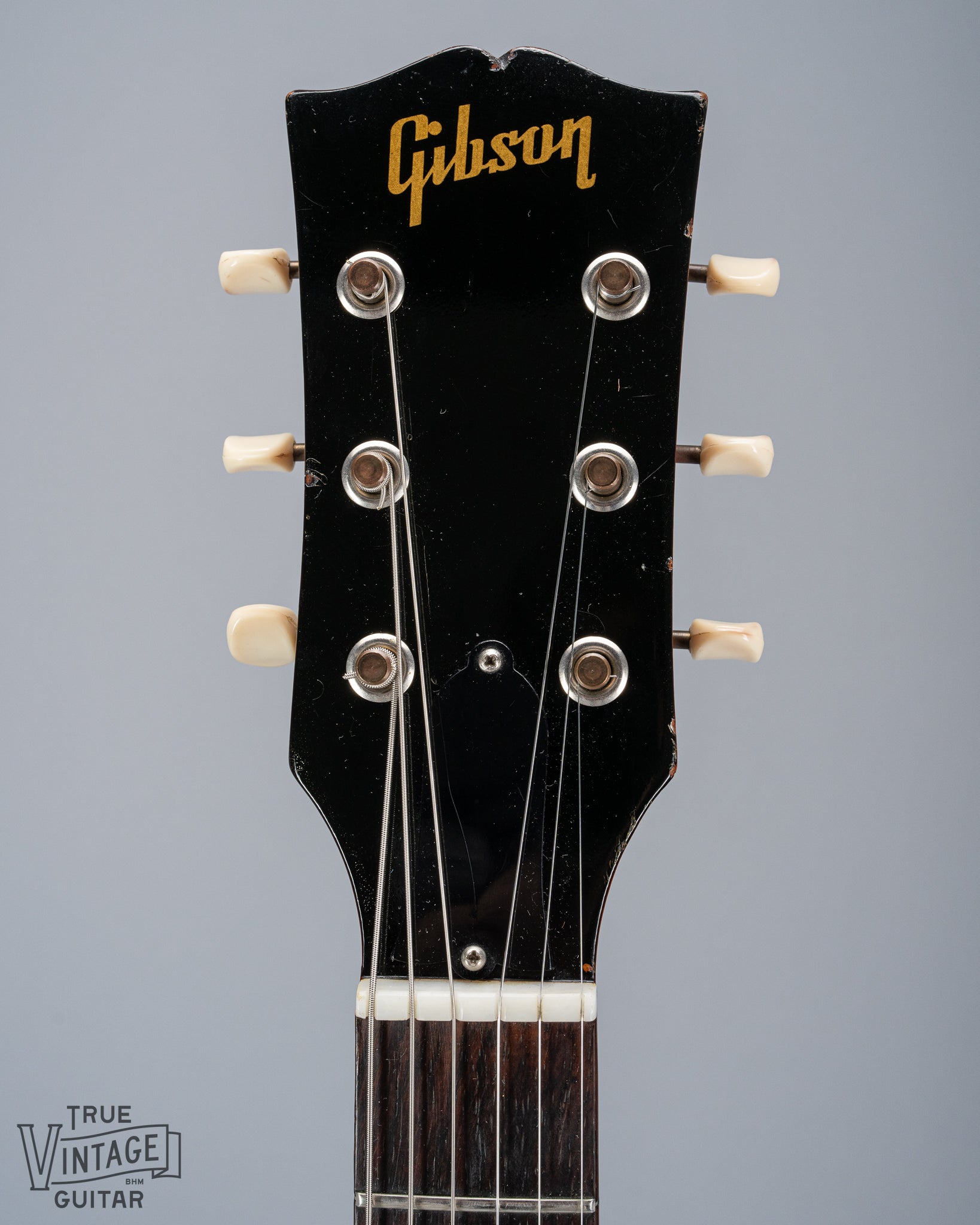 Front of 1964 Gibson SG Junior Cherry guitar neck headstock fretboard original frets tuner buttons Gibson logo nut truss rod cover