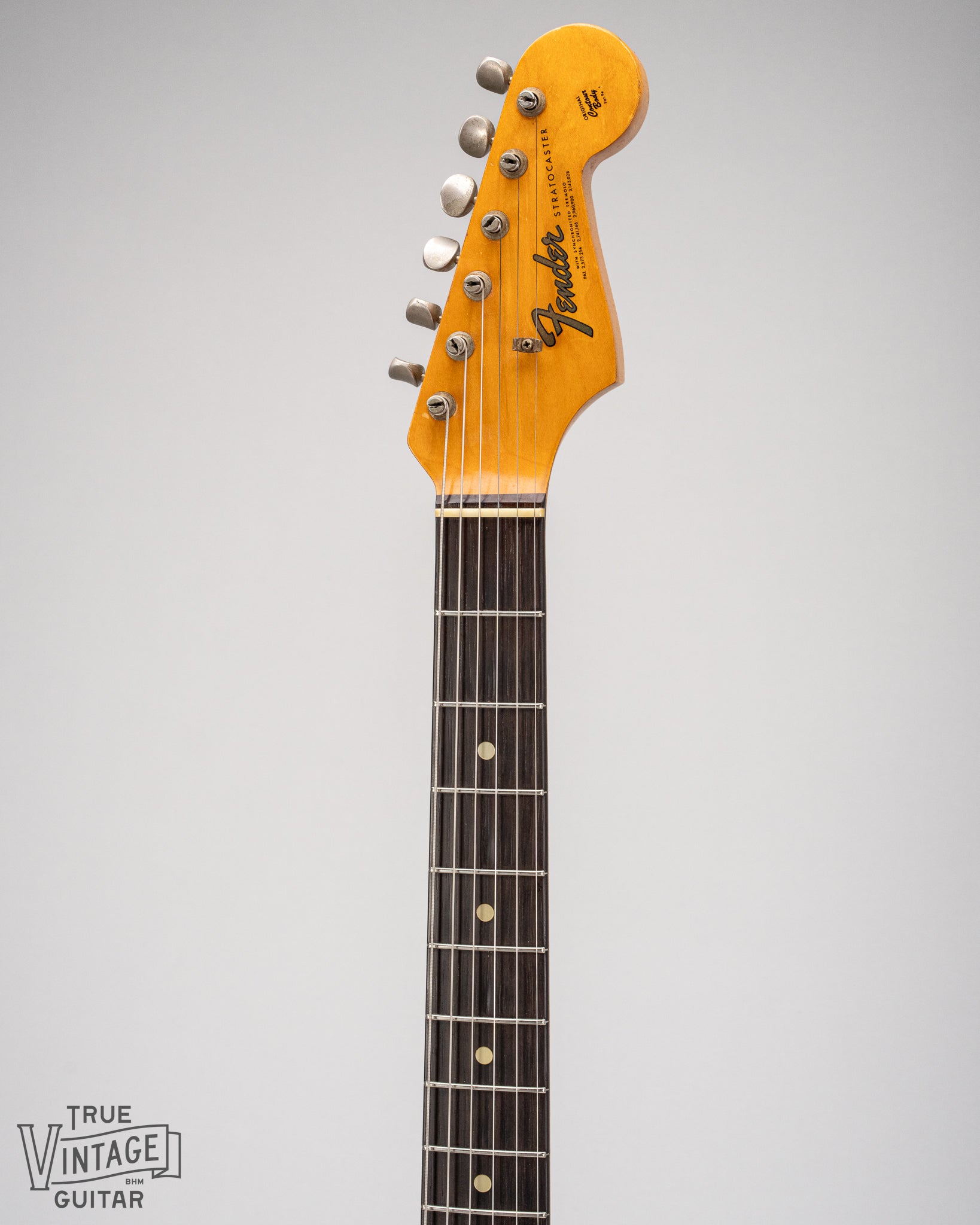 1965 Fender Stratocaster Fiesta Red custom color guitar front of neck and headstock, Brazilian Rosewood fretboard