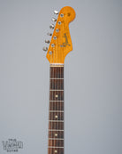 front of 1965 Fender Stratocaster Sunburst guitar neck headstock and fretboard Fender logo nut tuning machines