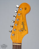 front of 1965 Fender Stratocaster Sunburst guitar headstock Fender logo nut tuning machines