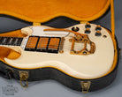 Front of 1965 Gibson SG Custom white guitar three pickup with Bigsby B5 vibrato tailpiece in original case