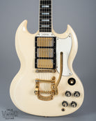 Front of 1965 Gibson SG Custom white guitar three pickup with Bigsby B5 vibrato tailpiece