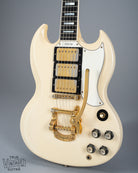 Front of 1965 Gibson SG Custom white guitar three pickup with Bigsby B5 vibrato tailpiece