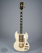 Front of 1965 Gibson SG Custom white guitar three pickup bigsby volume and tone controls block inlays fretboard binding gold neck headstock tuners block inlays