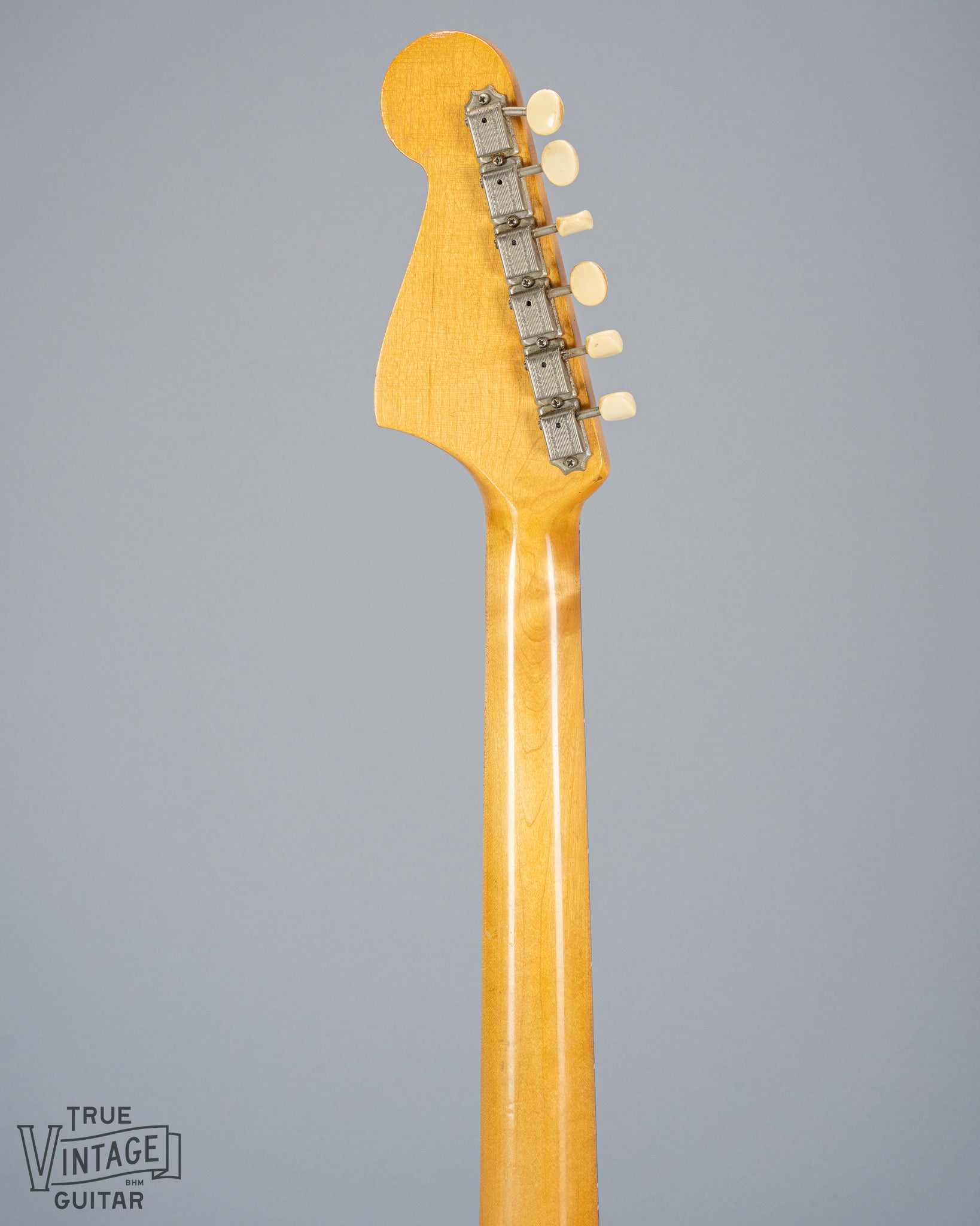 Back of 1965 Fender Mustang Red guitar neck and headstock tuning machines