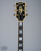 Front of 1965 Gibson SG Custom white guitar three pickup with Bigsby B5 vibrato tailpiece neck and headstock logo 