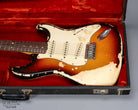 front of 1970 Fender Stratocaster sunburst   over white guitar body in original case