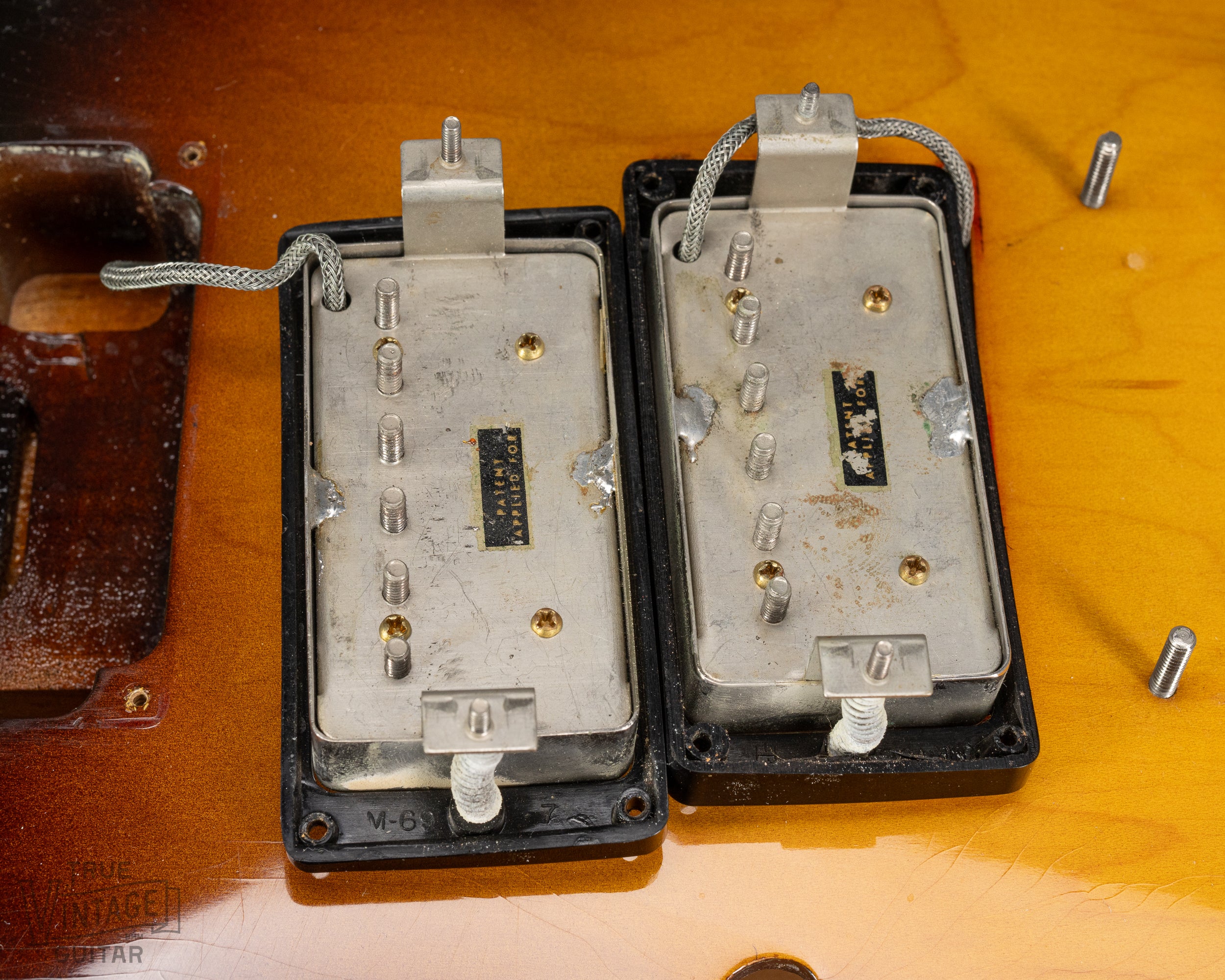 PAF patent applied for humbucking pickups inside of a 1959 Gibson ES-335. The black plastic rings are marked "M-69".