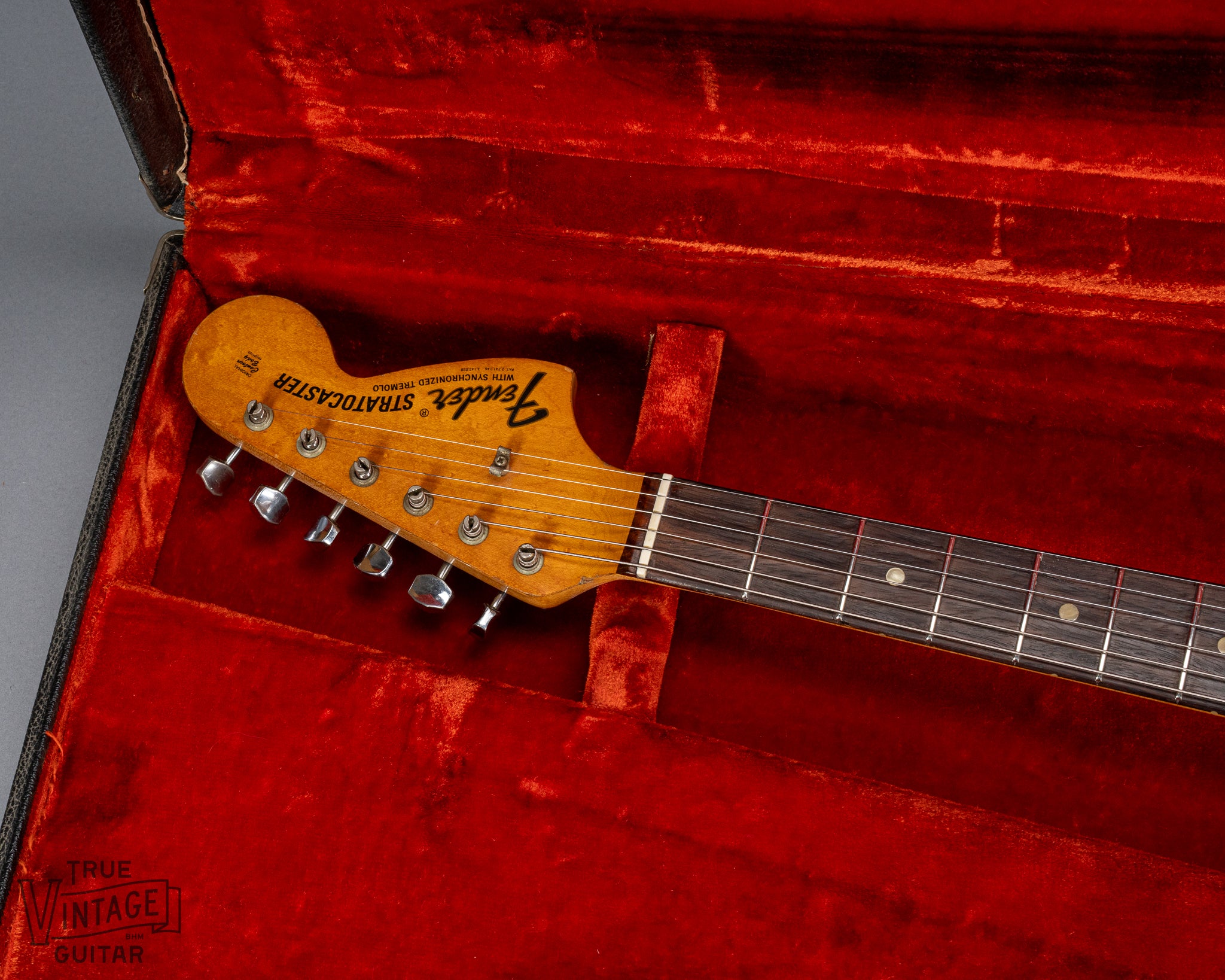 front of 1970 Fender Stratocaster sunburst over white headstock Fender logo tuners and original nut in original case