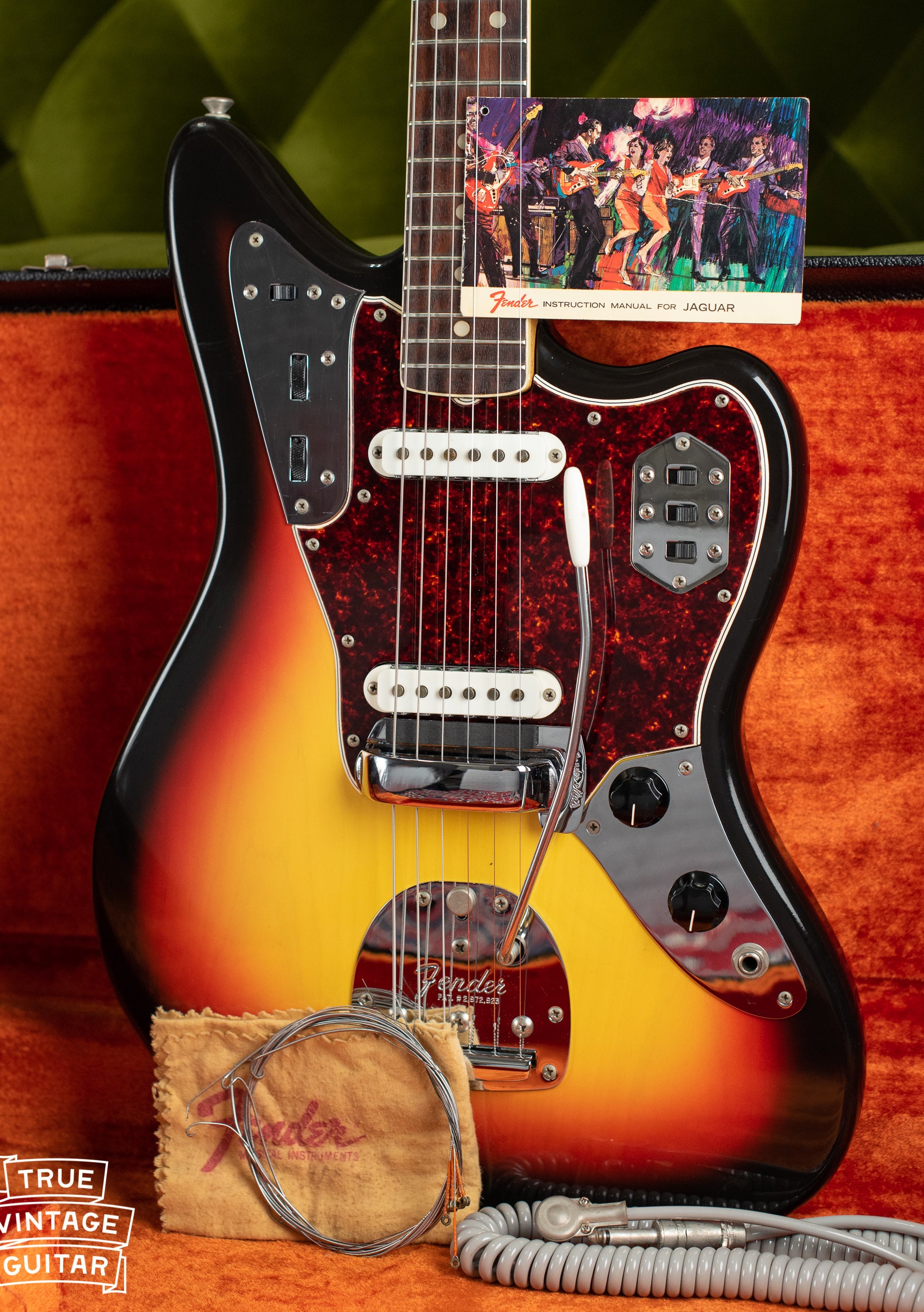 Vintage 1966 Fender Jaguar electric guitar, Sunburst finish, with hang tag and polish cloth