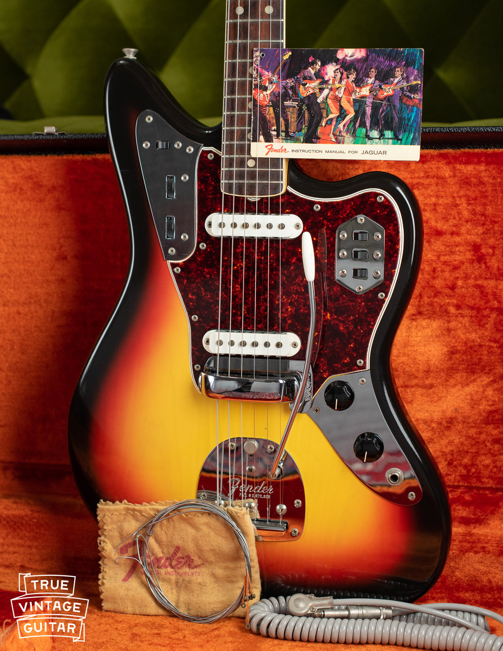 Vintage 1966 Fender Jaguar electric guitar, Sunburst finish, with hang tag and polish cloth