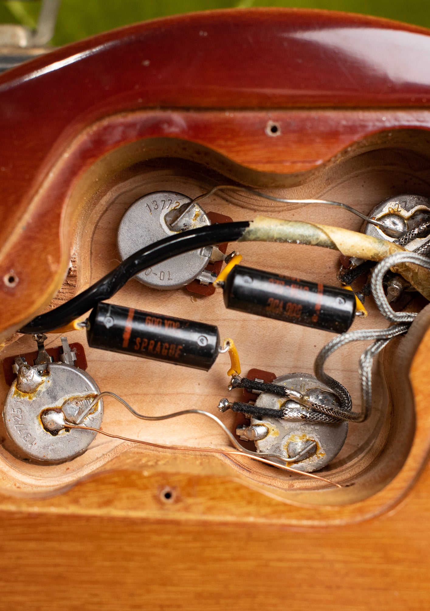 Control cavity, potentiometers, black Sprague capacitors, Vintage 1972 Gibson Les Paul Deluxe electric guitar