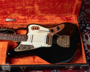Black Jaguar with gold hardware. Vintage Fender guitar from 1965. 