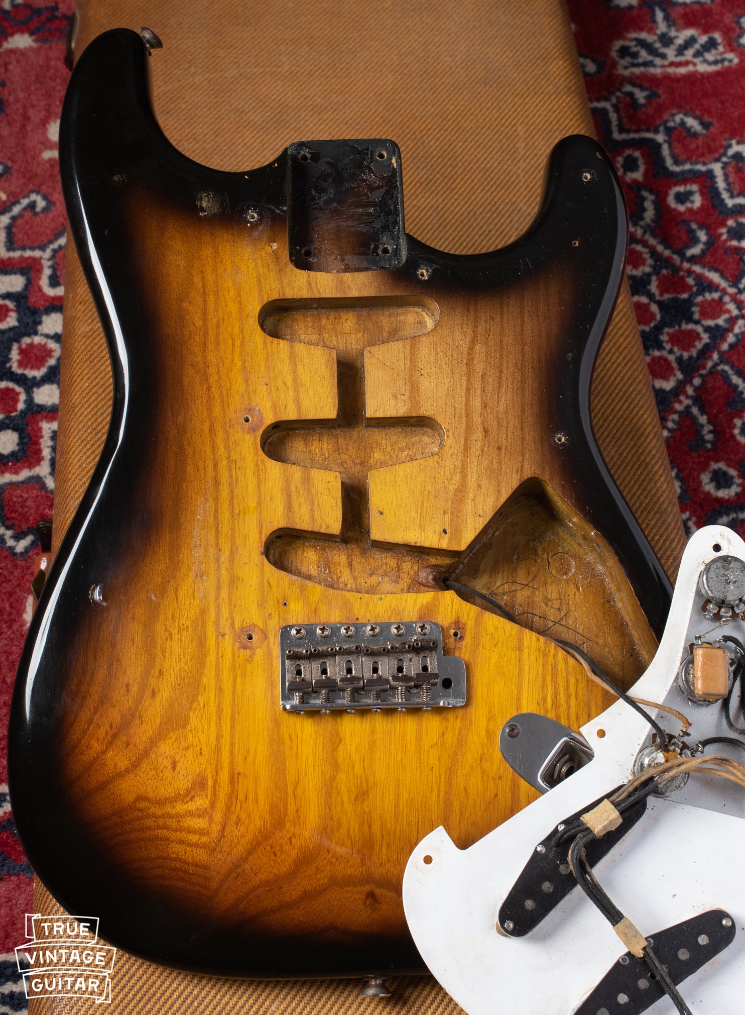 Ash body under pickguard of Fender Stratocaster 1954