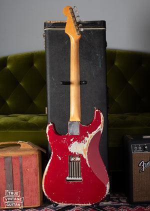 Back of Fender Stratocaster 1964 with worn Candy Apple Red finish
