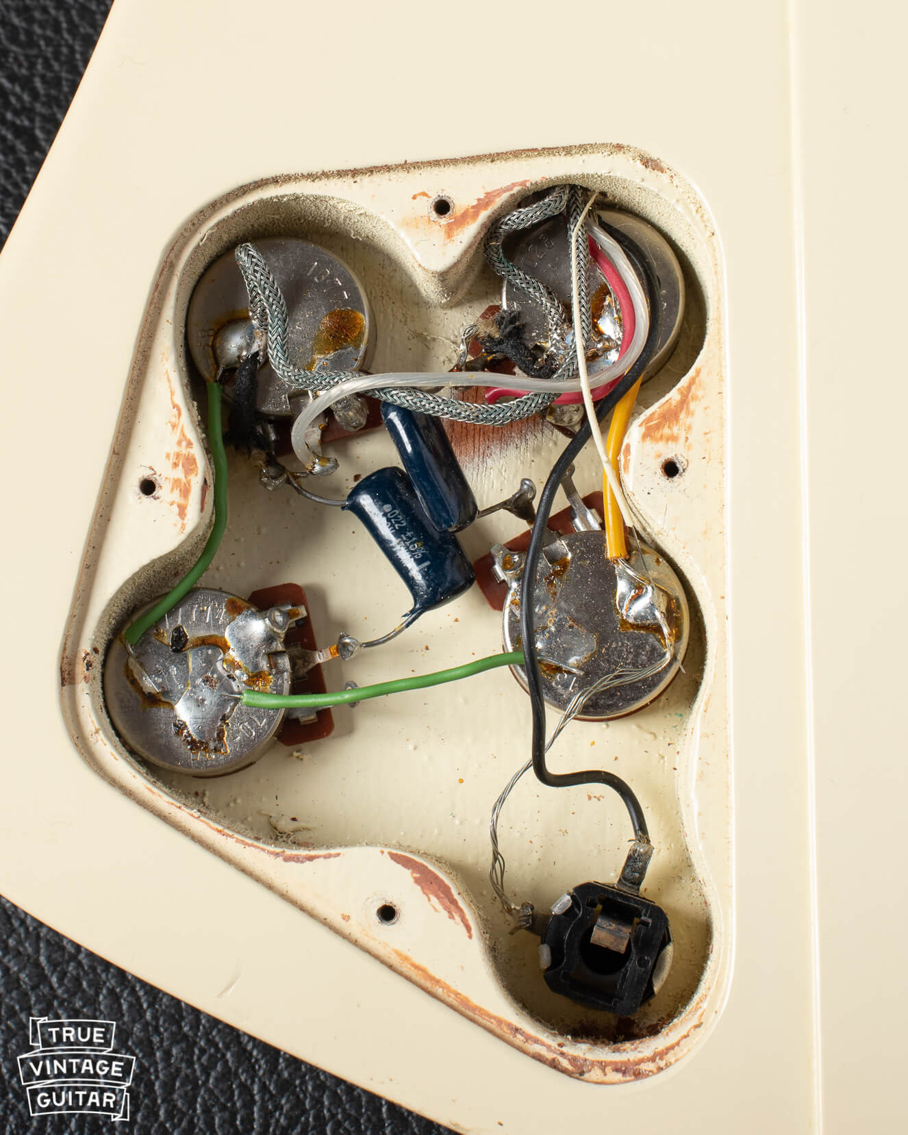 Control cavity with potentiometer codes on Gibson Firebird 76 White 1977