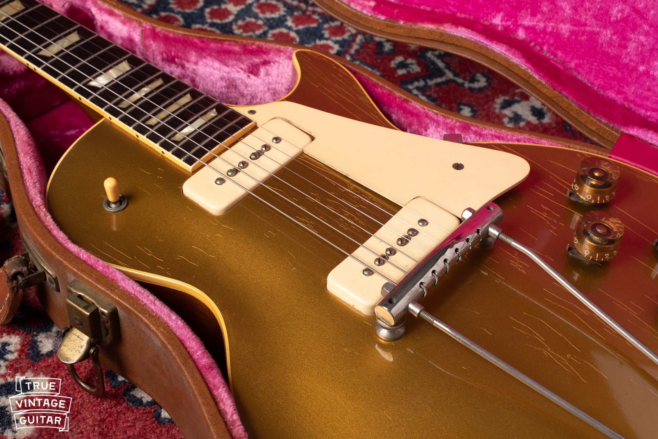 P-90 pickups, gold finish, yellow catalin switch tip