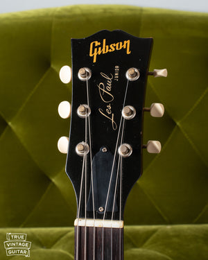 Black Headstock showing gold Gibson logo and Les Paul signature with Junior model underneath